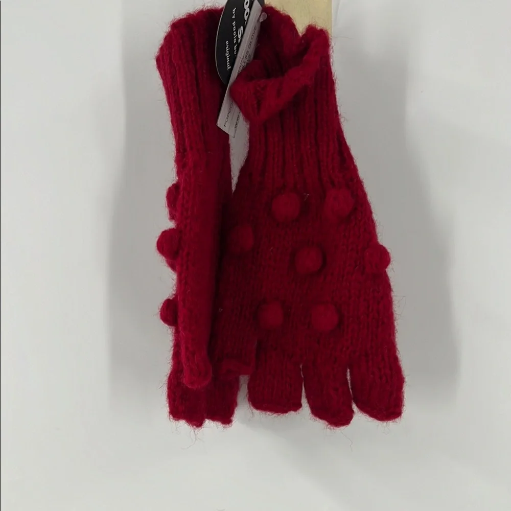 Wooden ships popcorn, fingerless glove with red raised Swiss dot bobble